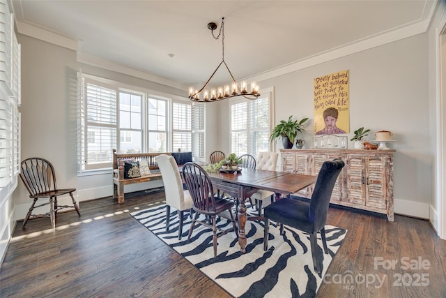 dining room featuring a notable chandelier, crown molding, and a healthy amount of sunlight