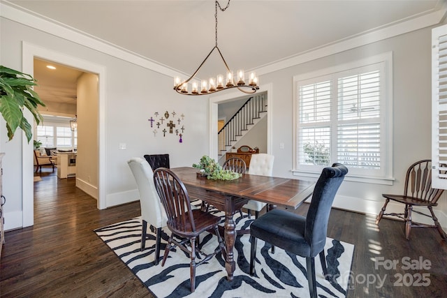 dining room featuring dark hardwood / wood-style flooring and ornamental molding