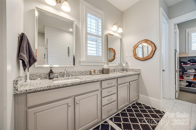 bathroom featuring vanity and a healthy amount of sunlight