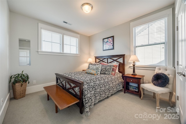 bedroom featuring light carpet