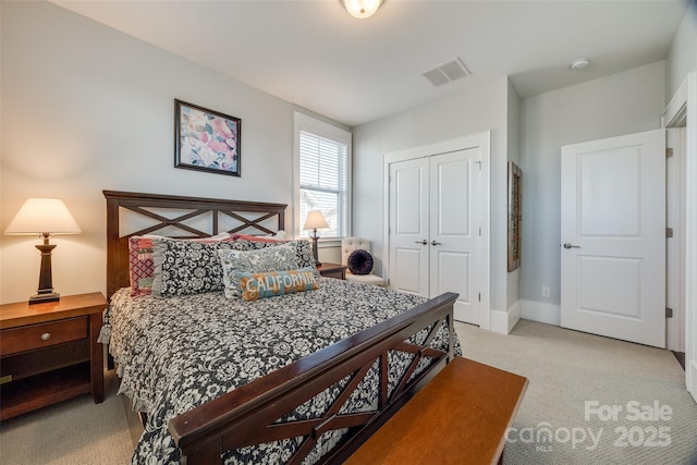 carpeted bedroom featuring a closet