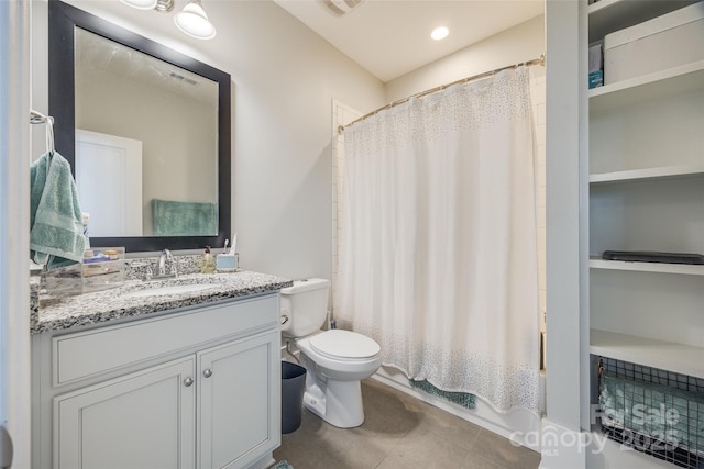 full bathroom featuring shower / bath combination with curtain, tile patterned floors, vanity, and toilet