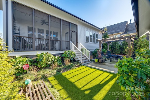 rear view of house with a yard, a patio area, and a pergola