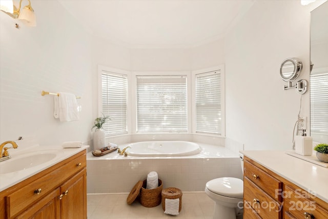 bathroom with toilet, vanity, tiled bath, and tile patterned flooring