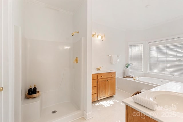 bathroom featuring vanity, separate shower and tub, and crown molding