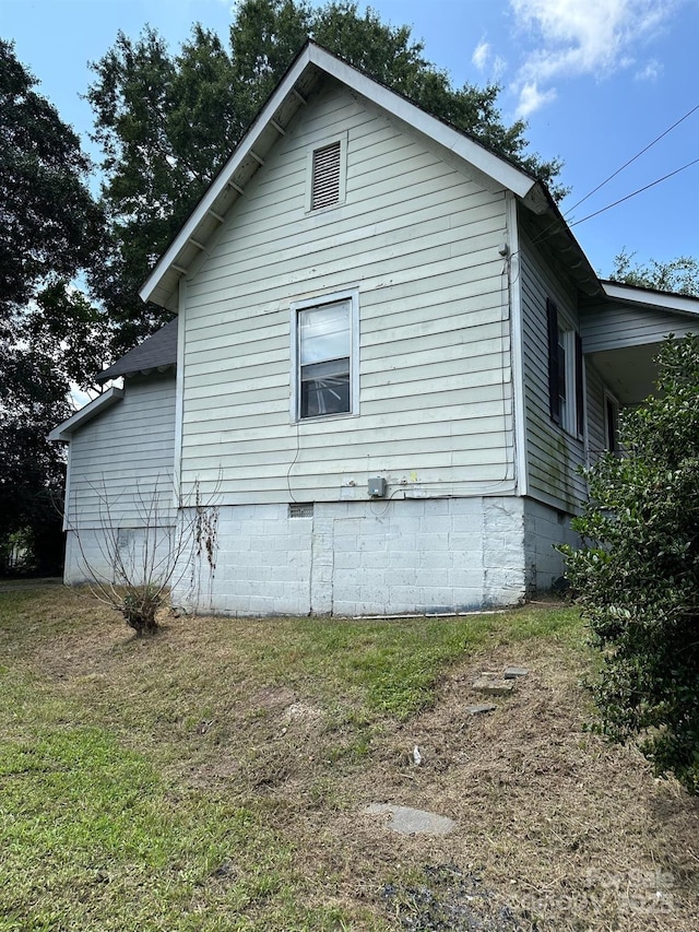 view of home's exterior featuring a lawn