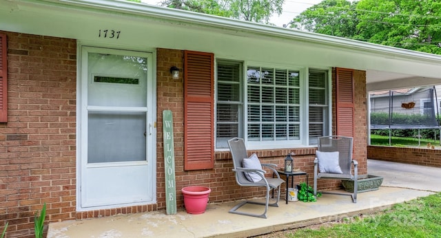 property entrance featuring covered porch