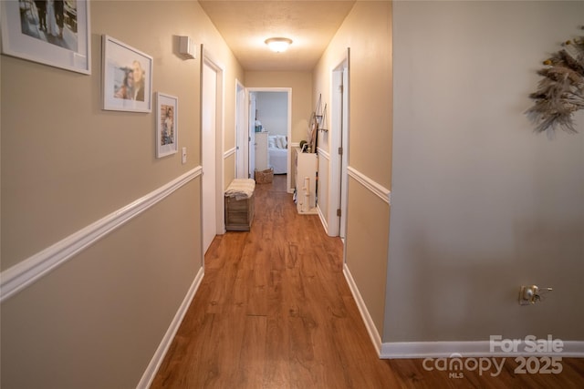 hallway with light wood-type flooring