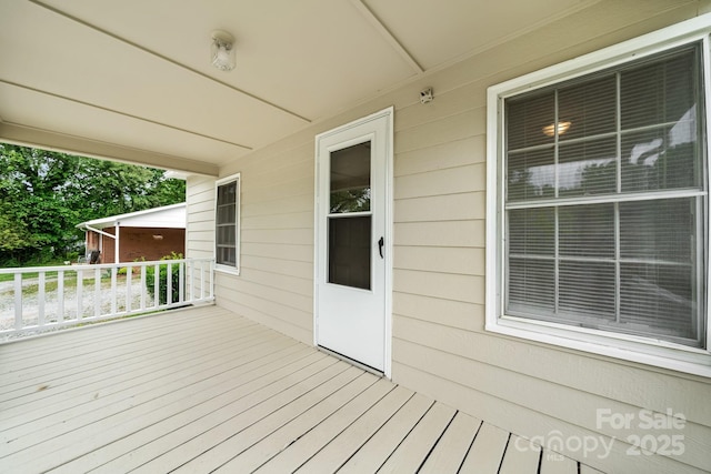 wooden deck featuring a porch