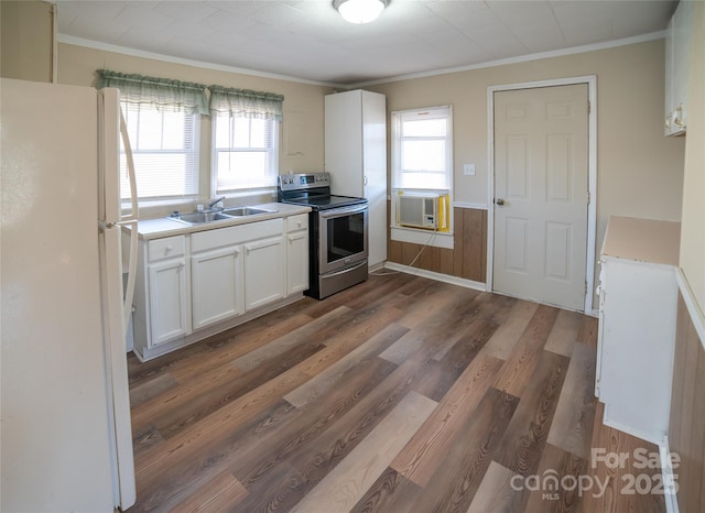 kitchen featuring dark wood-type flooring, sink, white fridge, stainless steel electric stove, and white cabinets