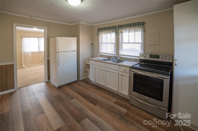 kitchen with sink, white cabinets, white refrigerator, ornamental molding, and electric stove