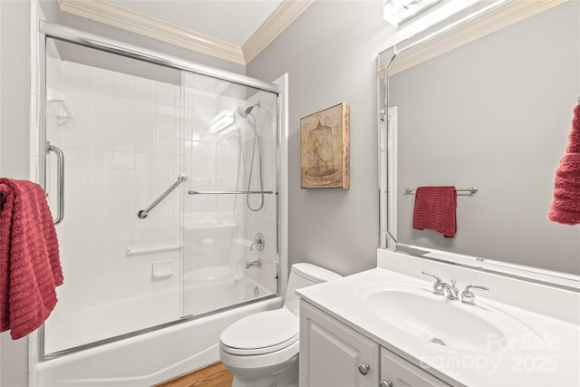 full bathroom with enclosed tub / shower combo, ornamental molding, toilet, and vanity