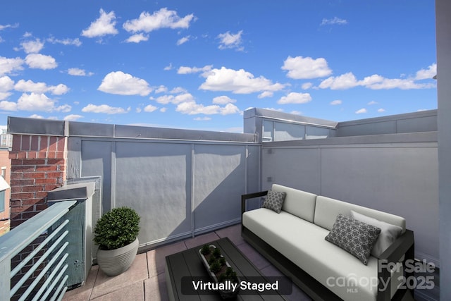 view of patio / terrace featuring a balcony and an outdoor living space