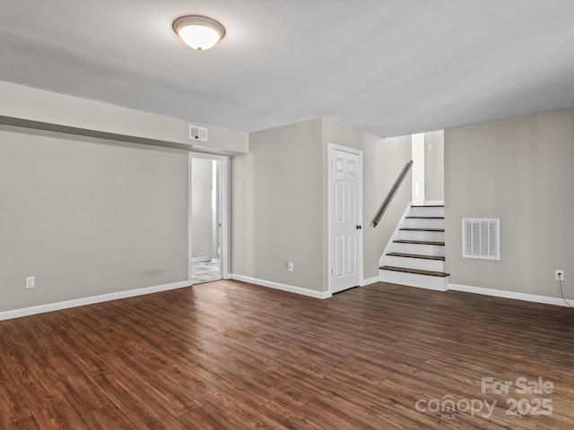 basement with dark hardwood / wood-style flooring