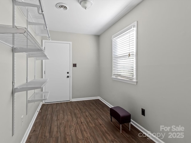 laundry room with dark wood-type flooring