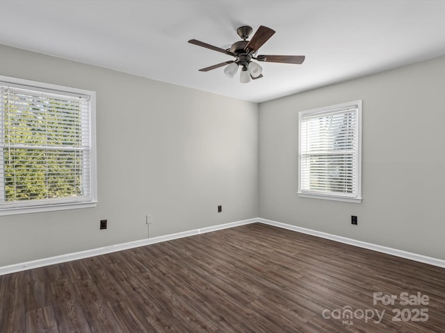 unfurnished room featuring dark hardwood / wood-style flooring and ceiling fan