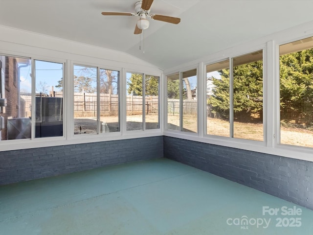 unfurnished sunroom with ceiling fan and lofted ceiling