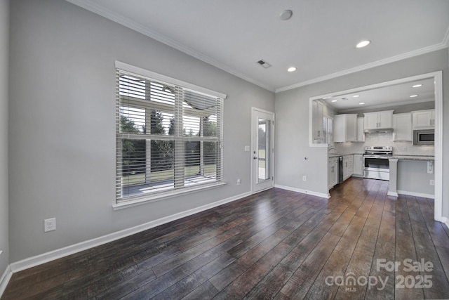 unfurnished living room with dark wood-type flooring and ornamental molding