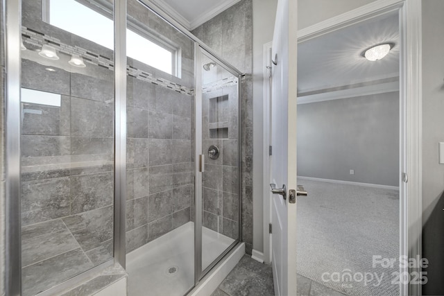 bathroom with an enclosed shower and crown molding