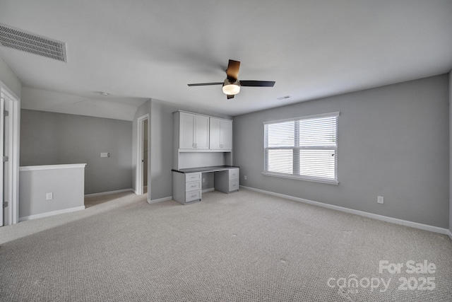 unfurnished bedroom with ceiling fan and light carpet