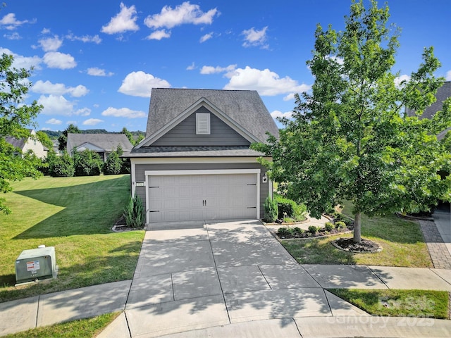 view of front facade with a garage and a front lawn