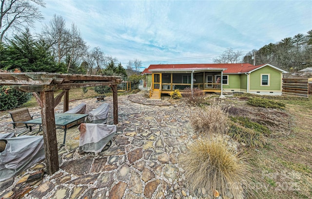 rear view of property with a patio, crawl space, a sunroom, and a pergola