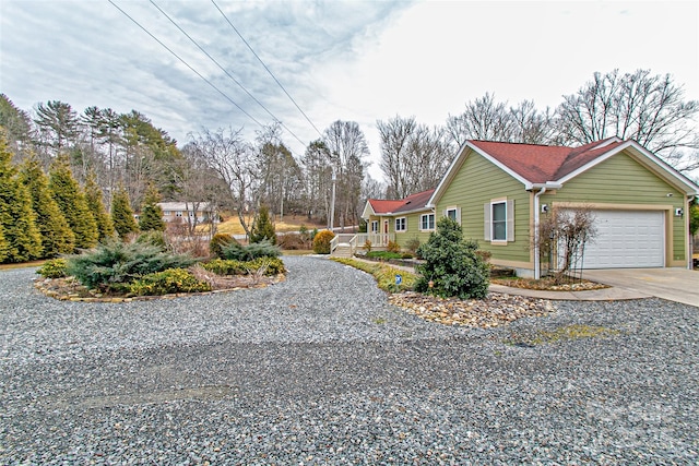 view of home's exterior featuring a garage and concrete driveway