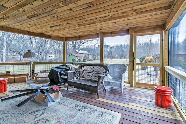 sunroom / solarium featuring wood ceiling