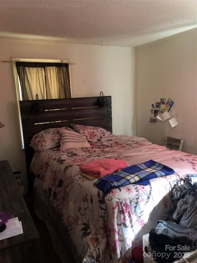 bedroom featuring a textured ceiling