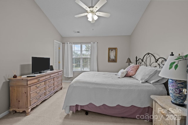 bedroom with lofted ceiling, light carpet, and ceiling fan