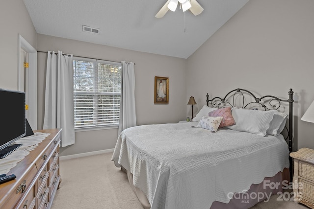 carpeted bedroom with lofted ceiling and ceiling fan