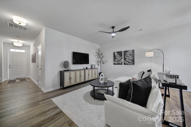 living room with hardwood / wood-style floors and ceiling fan