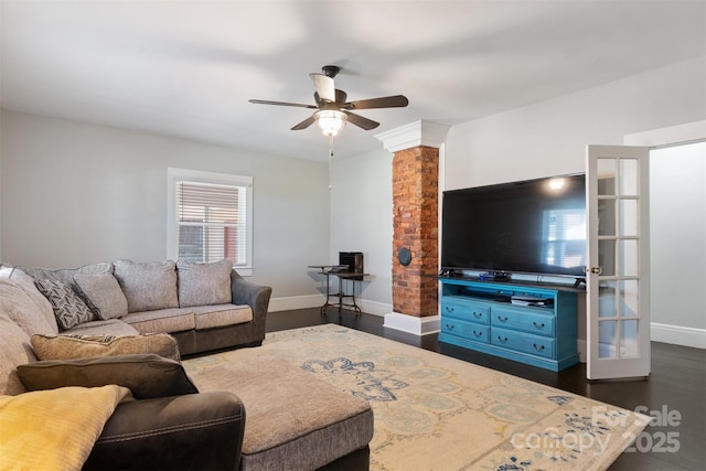 living room featuring dark hardwood / wood-style floors and ceiling fan