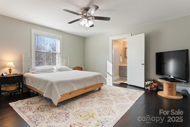 bedroom featuring ceiling fan, dark hardwood / wood-style floors, and ensuite bath