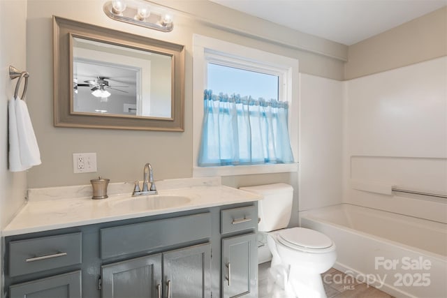 full bathroom with vanity, shower / bathing tub combination, and toilet