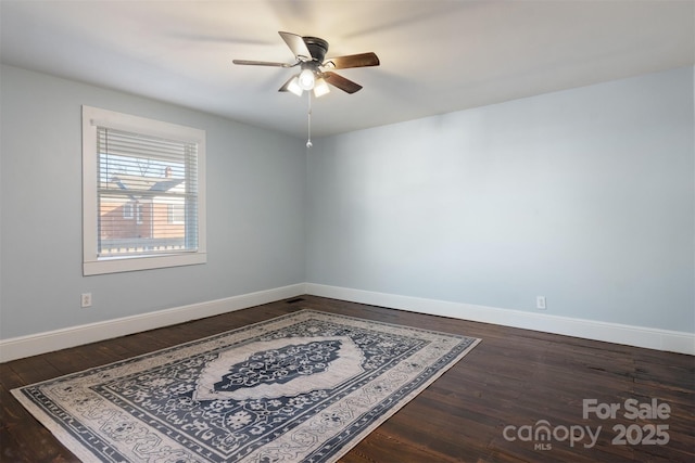 empty room with wood-type flooring and ceiling fan