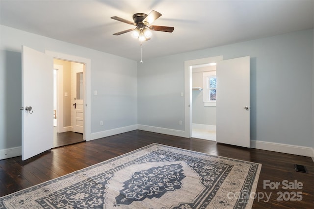 bedroom featuring dark wood-type flooring and ceiling fan