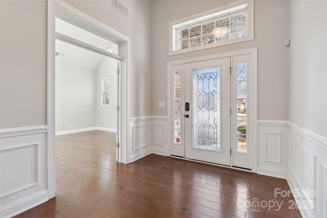 foyer entrance featuring dark hardwood / wood-style floors