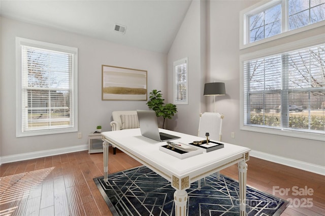 office with lofted ceiling, a wealth of natural light, and wood-type flooring