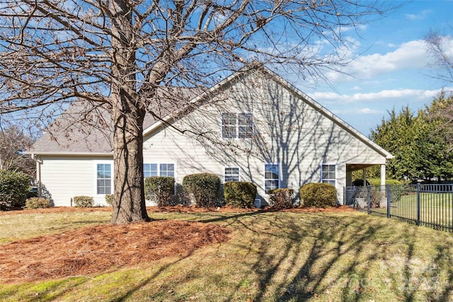 view of property exterior with a lawn