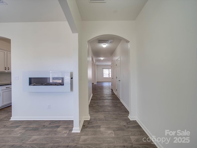 hall featuring dark wood-type flooring