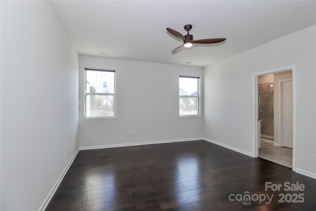 unfurnished room featuring dark wood-type flooring and ceiling fan