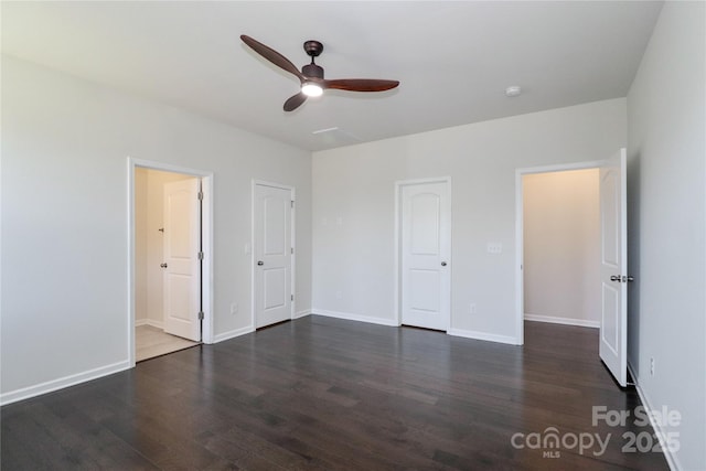 unfurnished bedroom with dark wood-type flooring and ceiling fan