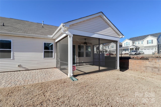 back of house featuring ceiling fan and a patio area