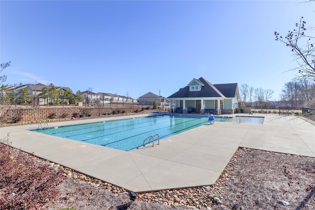 view of swimming pool with a patio