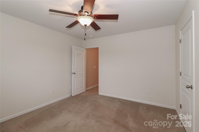 unfurnished bedroom with ceiling fan and light colored carpet