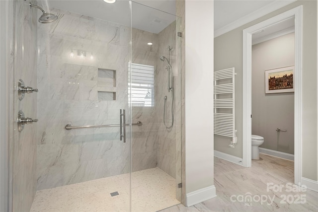 bathroom featuring walk in shower, toilet, radiator, and crown molding