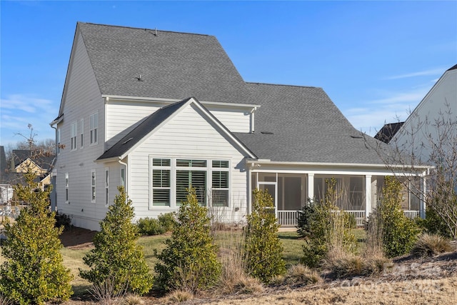 back of property featuring a sunroom