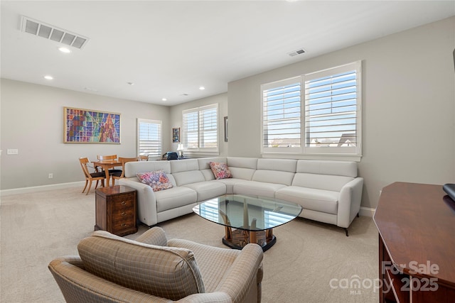 living room featuring light carpet