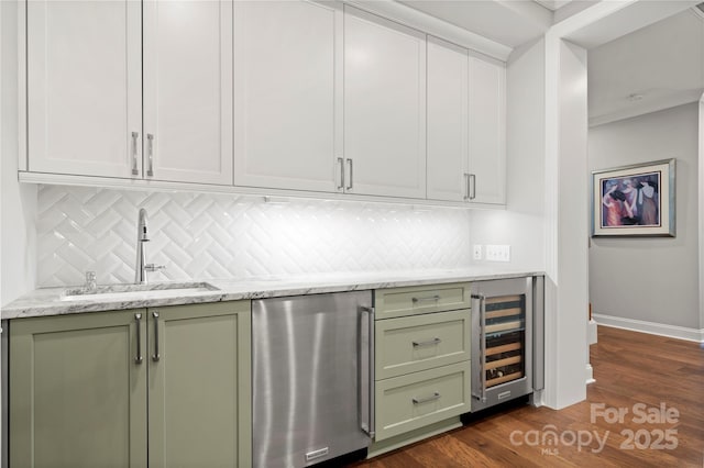 bar featuring wine cooler, sink, light stone counters, dark hardwood / wood-style flooring, and dishwasher